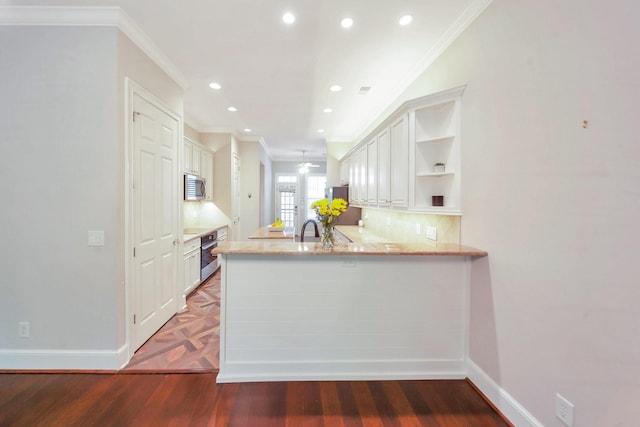 1007 State Blvd, Franklin, TN 37064 - kitchen with appliances with stainless steel finishes, open shelves, ornamental molding, baseboards, and a peninsula