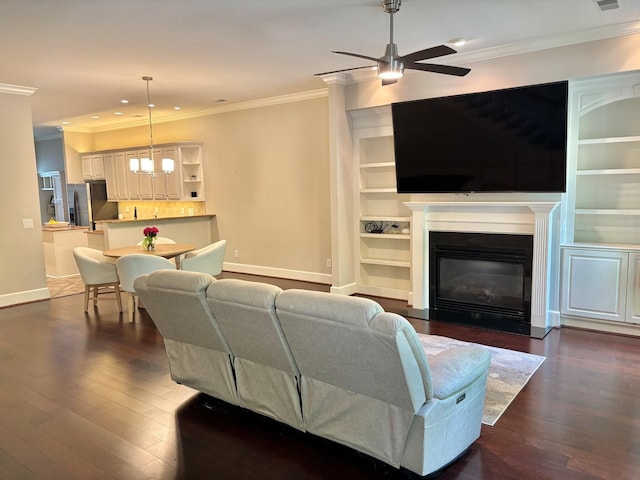 1007 State Blvd, Franklin, TN 37064 - living room featuring baseboards, crown molding, ceiling fan, dark wood-style floors, and a fireplace with flush hearth