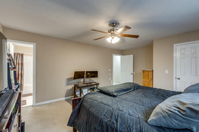 2962 Baby Ruth Ln Unit 8, Antioch, TN 37013 - bedroom with ceiling fan, baseboards, light carpet, ensuite bath, and a textured ceiling