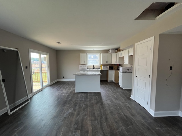 176 Cardinal Crk, Clarksville, TN 37040 - kitchen featuring a sink, a kitchen island, dark wood-style floors, and baseboards