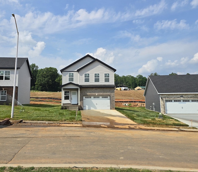 176 Cardinal Crk, Clarksville, TN 37040 - view of front facade featuring concrete driveway, a front yard, and brick siding
