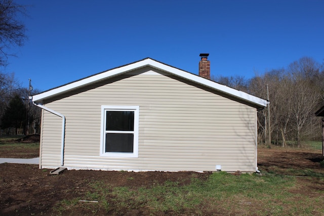 view of home's exterior featuring a chimney