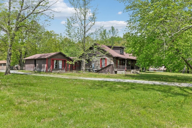log home featuring a front lawn and log exterior