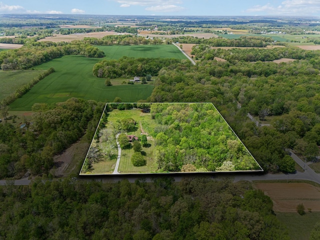 birds eye view of property featuring a rural view