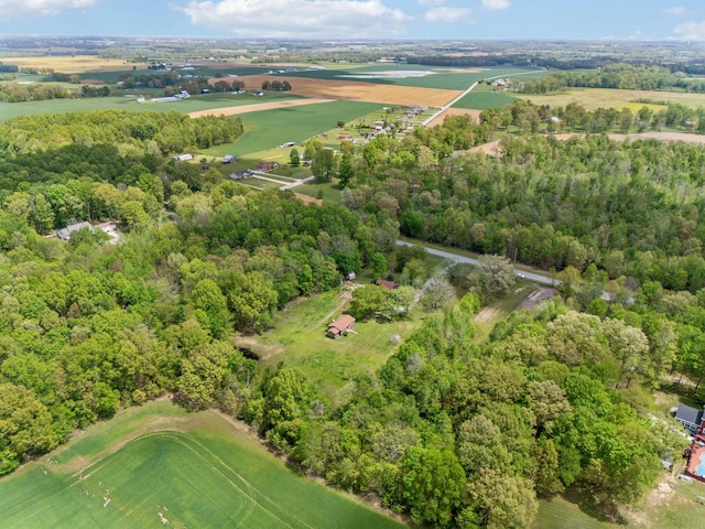 drone / aerial view with a wooded view