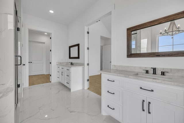 184 Emma Ln, Hohenwald, TN 38462 - full bathroom featuring an inviting chandelier, two vanities, recessed lighting, a sink, and marble finish floor