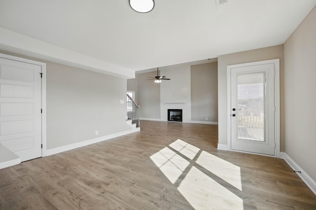 151 Cardinal Crk, Clarksville, TN 37040 - unfurnished living room featuring healthy amount of natural light, ceiling fan, and wood finished floors