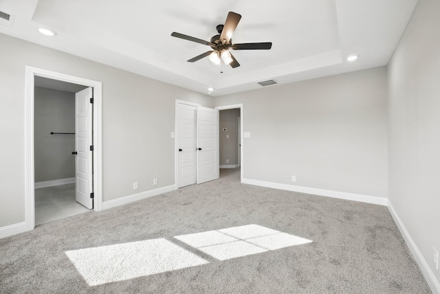 151 Cardinal Crk, Clarksville, TN 37040 - unfurnished bedroom featuring recessed lighting, carpet floors, a tray ceiling, baseboards, and a ceiling fan