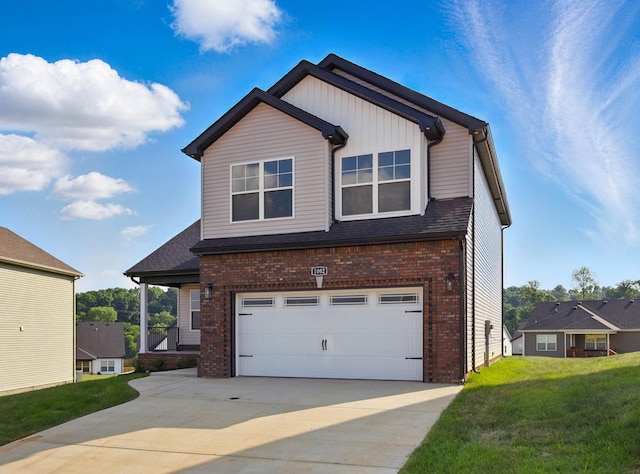 151 Cardinal Crk, Clarksville, TN 37040 - view of front of home with an attached garage, brick siding, concrete driveway, and a front lawn