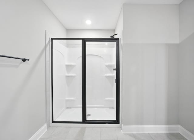 151 Cardinal Crk, Clarksville, TN 37040 - bathroom featuring baseboards, a shower stall, and tile patterned flooring