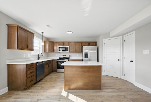 151 Cardinal Crk, Clarksville, TN 37040 - kitchen featuring appliances with stainless steel finishes, baseboards, light wood-style flooring, and a sink
