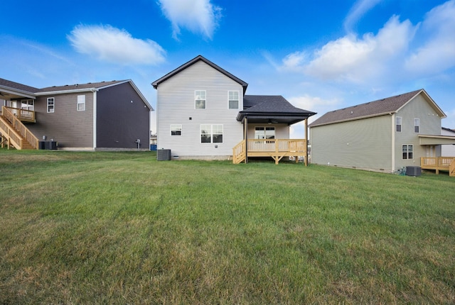 151 Cardinal Crk, Clarksville, TN 37040 - rear view of house featuring a ceiling fan, a yard, and central AC unit