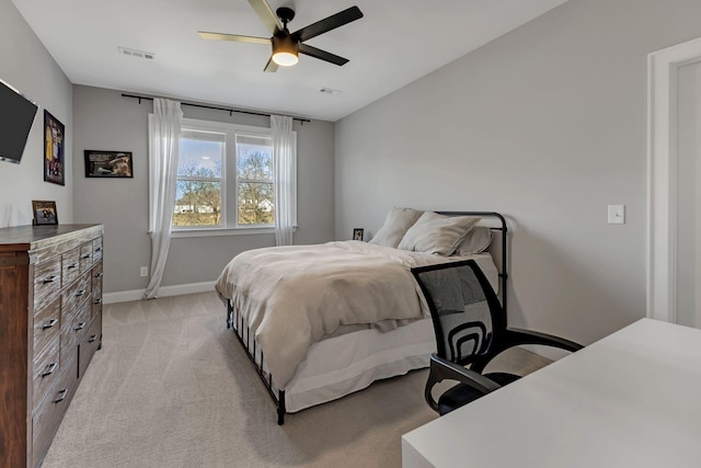 bedroom featuring visible vents, ceiling fan, light carpet, and baseboards