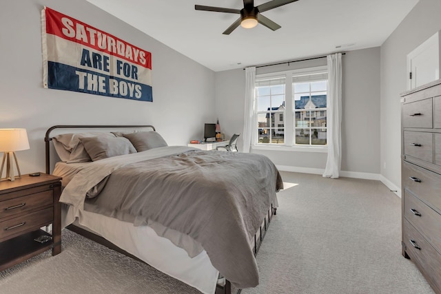 bedroom with baseboards, a ceiling fan, and carpet flooring