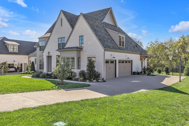 view of home's exterior with a yard, brick siding, a shingled roof, concrete driveway, and an attached garage