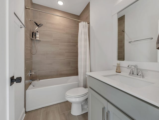 bathroom featuring shower / tub combo, recessed lighting, toilet, and vanity