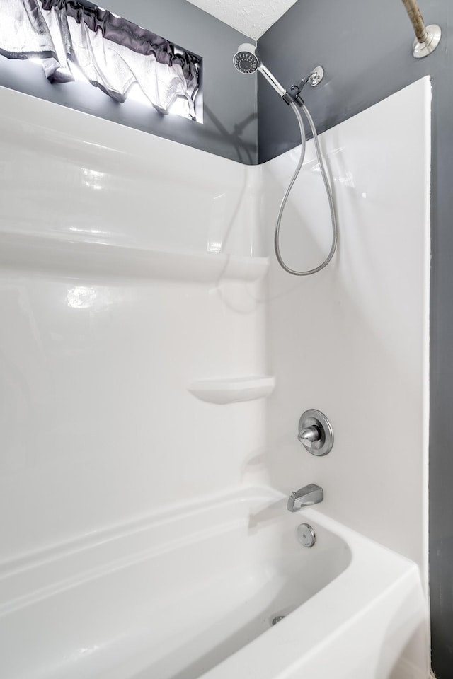 full bath featuring  shower combination