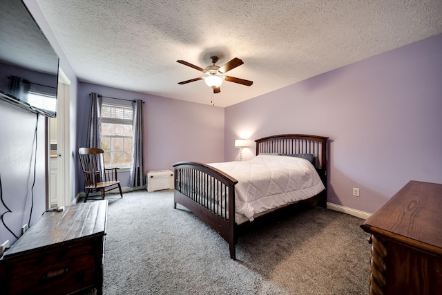 carpeted bedroom featuring a textured ceiling, ceiling fan, and baseboards