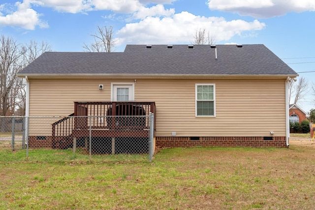 back of property featuring crawl space, a yard, fence, a shingled roof, and a deck