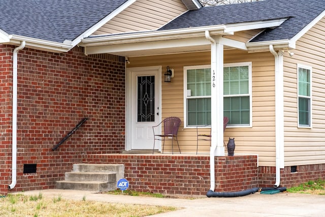 entrance to property with crawl space and roof with shingles