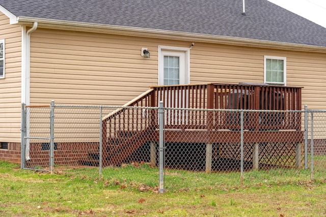 rear view of house featuring crawl space, a yard, fence, a shingled roof, and a deck