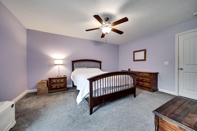 carpeted bedroom featuring ceiling fan and baseboards