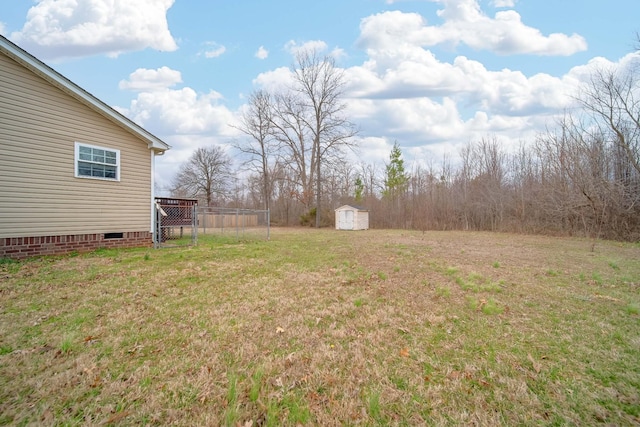 view of yard featuring an outbuilding and a storage unit