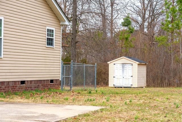 view of shed with fence