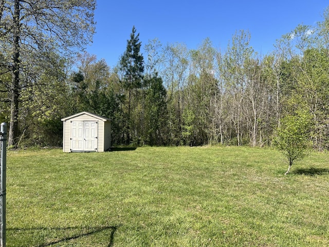 view of yard featuring an outbuilding and a shed