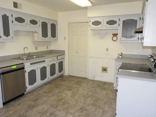 203 Valleydale St, Smyrna, TN 37167 - kitchen with a sink, under cabinet range hood, stainless steel appliances, light countertops, and glass insert cabinets