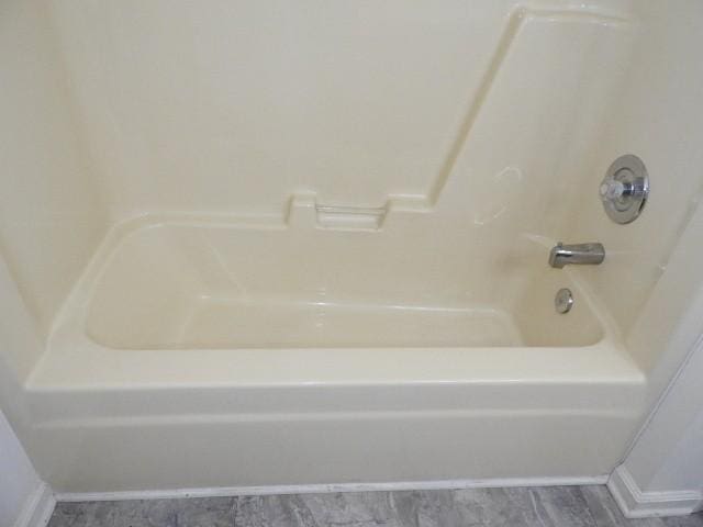 203 Valleydale St, Smyrna, TN 37167 - bathroom featuring shower / bathtub combination and wood finished floors