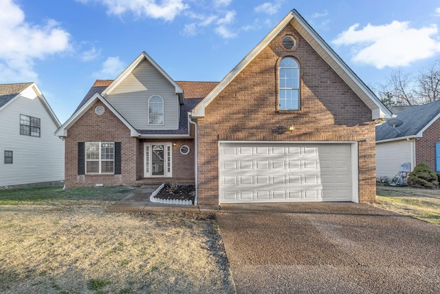 traditional home featuring brick siding, a front lawn, roof with shingles, a garage, and driveway