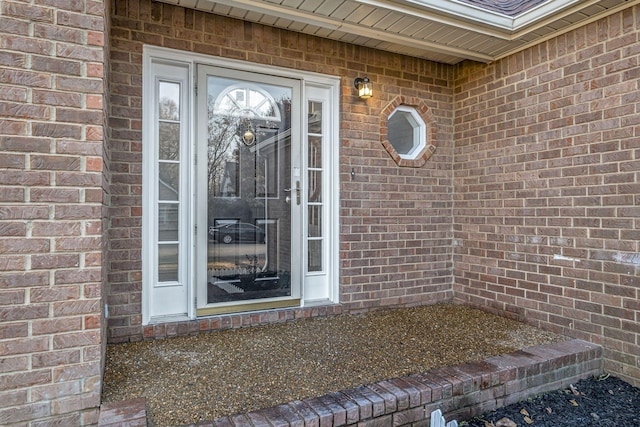 property entrance with brick siding
