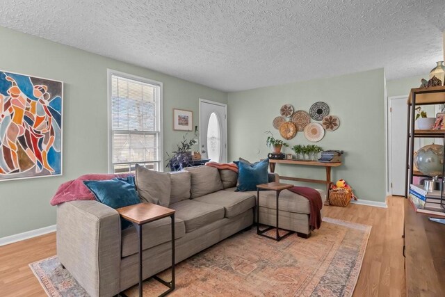 109 Robin Hood Rd, Dickson, TN 37055 - living area featuring a textured ceiling, baseboards, and wood finished floors