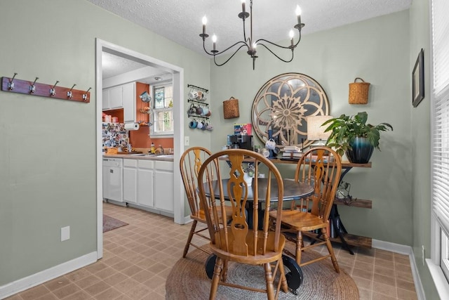 109 Robin Hood Rd, Dickson, TN 37055 - dining room featuring baseboards, a textured ceiling, and a chandelier