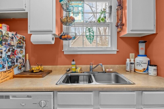 109 Robin Hood Rd, Dickson, TN 37055 - kitchen featuring white cabinetry, a sink, and dishwasher