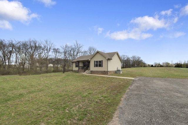 view of front of property with crawl space and a front lawn