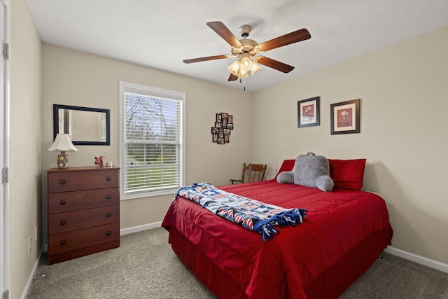 bedroom featuring baseboards, a ceiling fan, and carpet flooring
