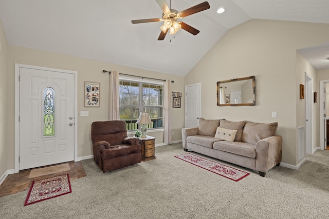 living area with visible vents, baseboards, ceiling fan, carpet floors, and high vaulted ceiling