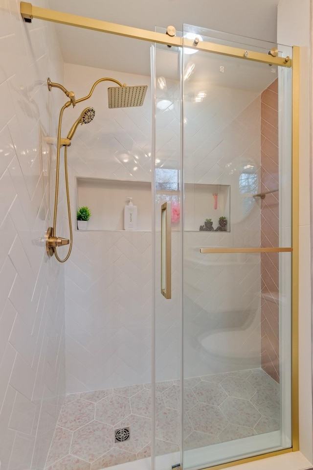 full bath with a shower stall