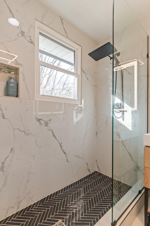 full bath with a marble finish shower