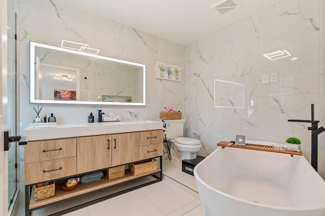 full bathroom with visible vents, toilet, vanity, and a freestanding bath