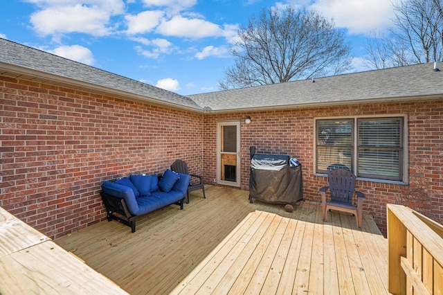 wooden terrace featuring area for grilling