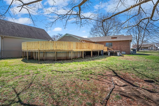 view of yard with a swimming pool and a wooden deck
