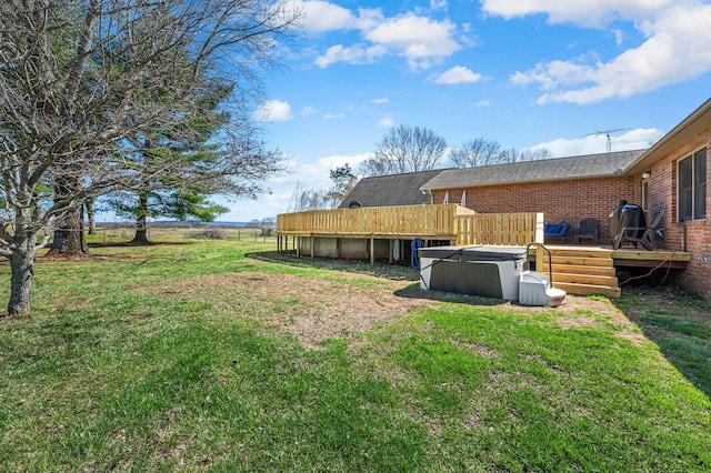 view of yard with a swimming pool, a wooden deck, and fence