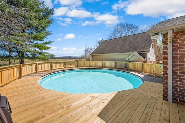 view of pool with a deck and a fenced in pool