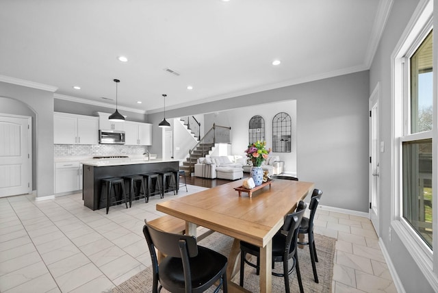 1044 Thrasher Dr, Clarksville, TN 37040 - dining area featuring stairway, visible vents, baseboards, recessed lighting, and ornamental molding