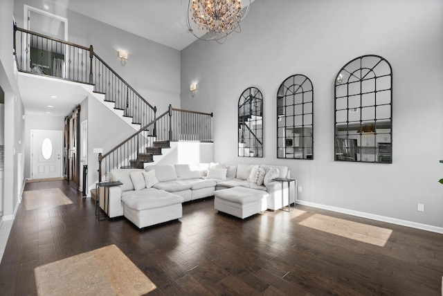 1044 Thrasher Dr, Clarksville, TN 37040 - living area with stairs, a high ceiling, wood finished floors, and baseboards