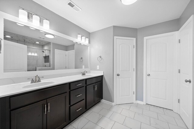 1044 Thrasher Dr, Clarksville, TN 37040 - full bathroom featuring a shower stall, visible vents, marble finish floor, and a sink