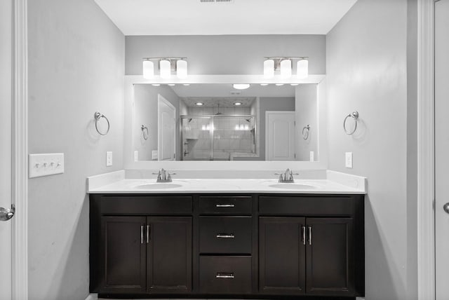 1044 Thrasher Dr, Clarksville, TN 37040 - full bathroom with double vanity, visible vents, a stall shower, and a sink